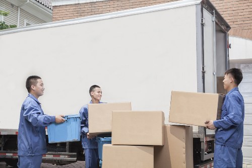 Removal van and moving team preparing house removals in Eltham