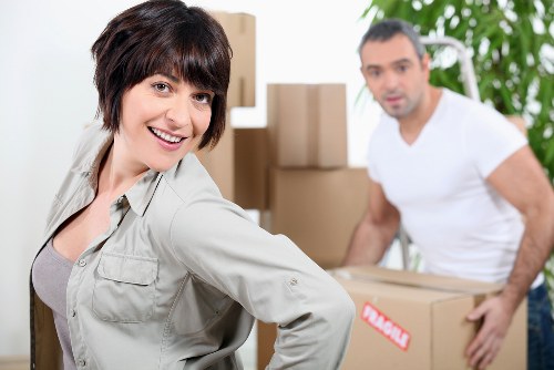 Unpacking boxes and setting up a new room after a move in Eltham