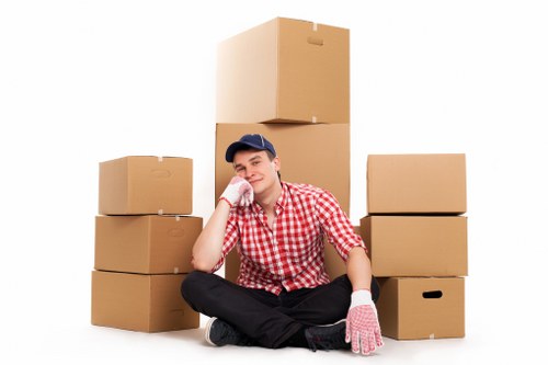 Packed household boxes and furniture ready for a move in Eltham